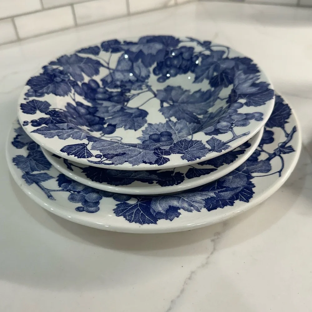 Four Crate and Barrel and Windsor Blue and White Grapevine place settings